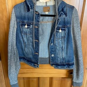 Crop jean jacket with sweatshirt sleeves and hood